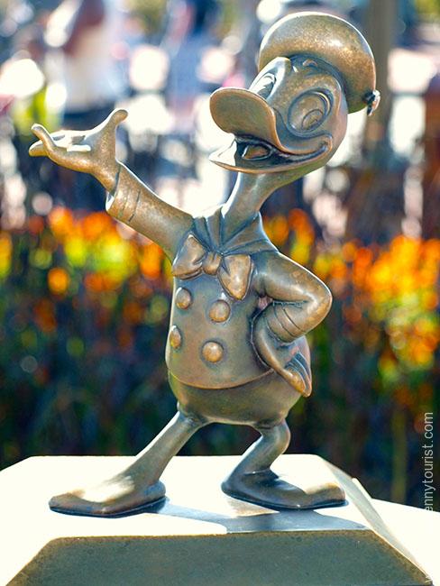 The Donald mini statue in it's old location on the Castle hub in the Magic Kingdom, Walt Disney World