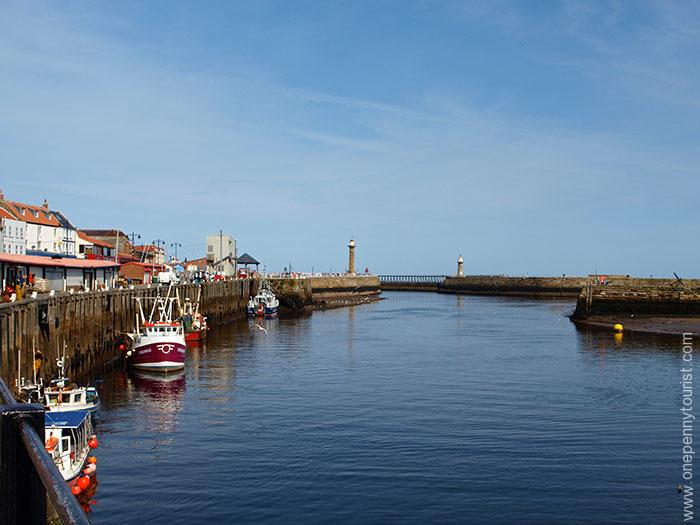 Looking out of Whitby Harbour in North Yorkshire, a great choice for your UK Seaside Bucket List. OnePennyTourist.com