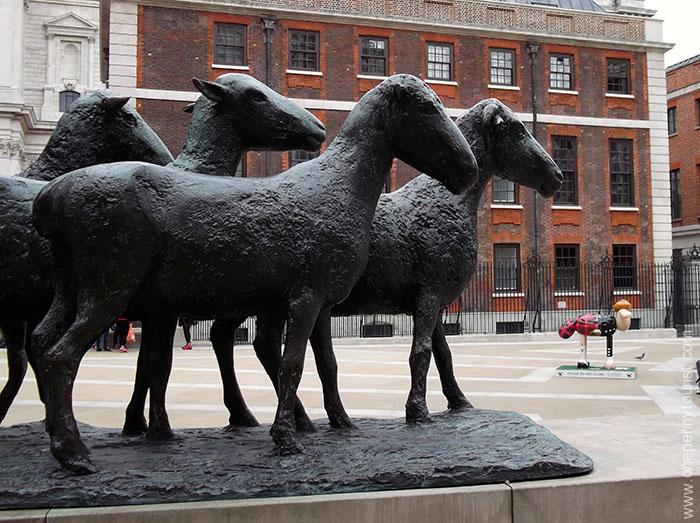 Shepherd and Sheep statue in Paternoster Square with Hamish Shaun. Part of the Shaun in the City Art Trail in London.