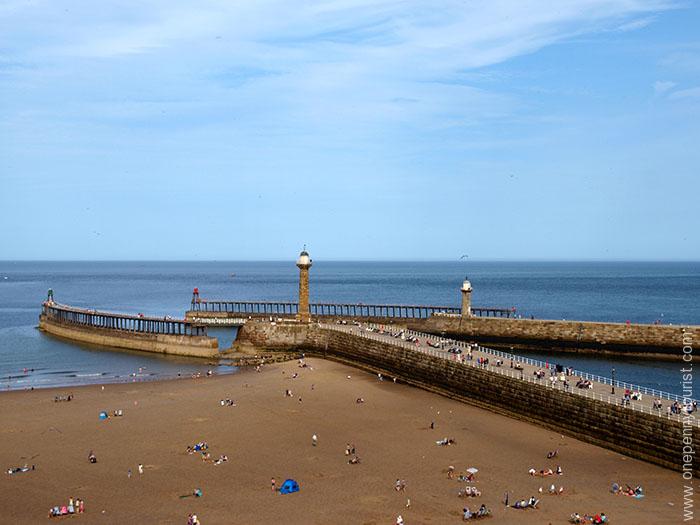 View from West Cliff of the harbour wall in Whitby, North Yorkshire